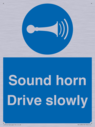 sound-horn-drive-slowly-warehousing-and-delivery-sign~